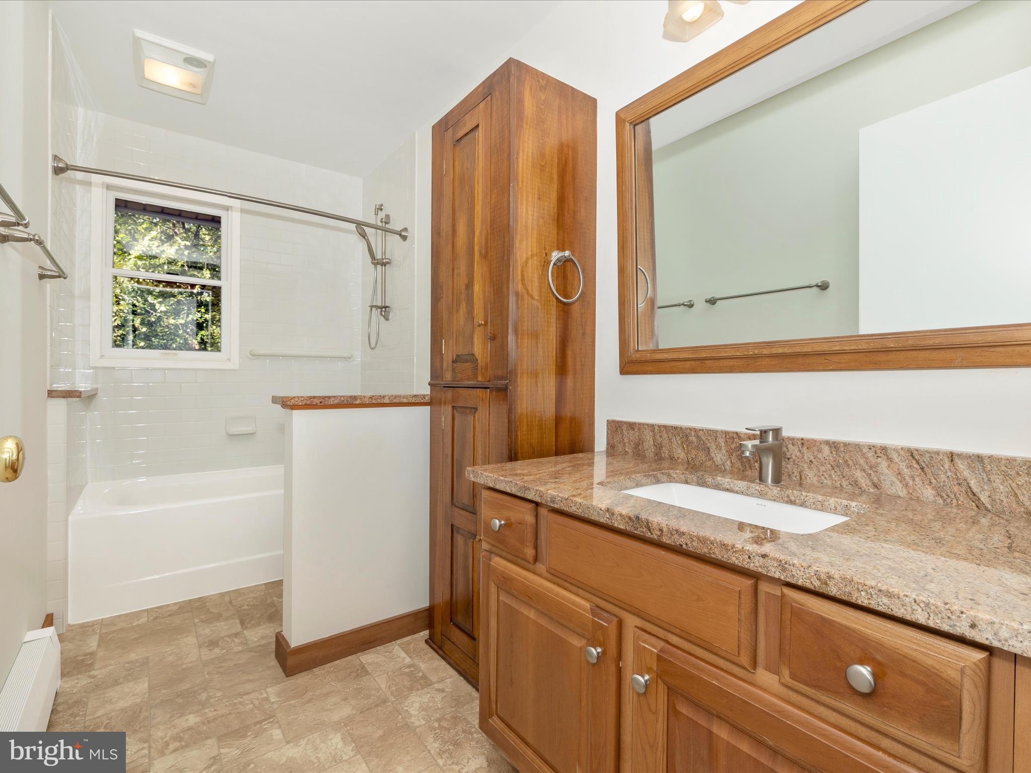 12436 Legore Road Keymar, MD 21757 - Photo 41 of 72 a bathroom with a granite countertop sink and a mirror