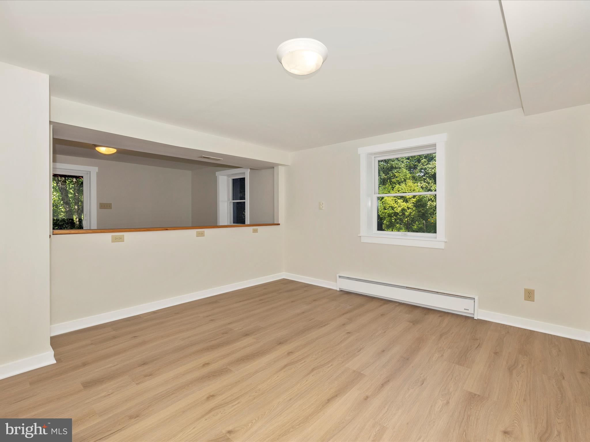 12436 Legore Road Keymar, MD 21757 - Photo 47 of 72 an empty room with wooden floor and windows