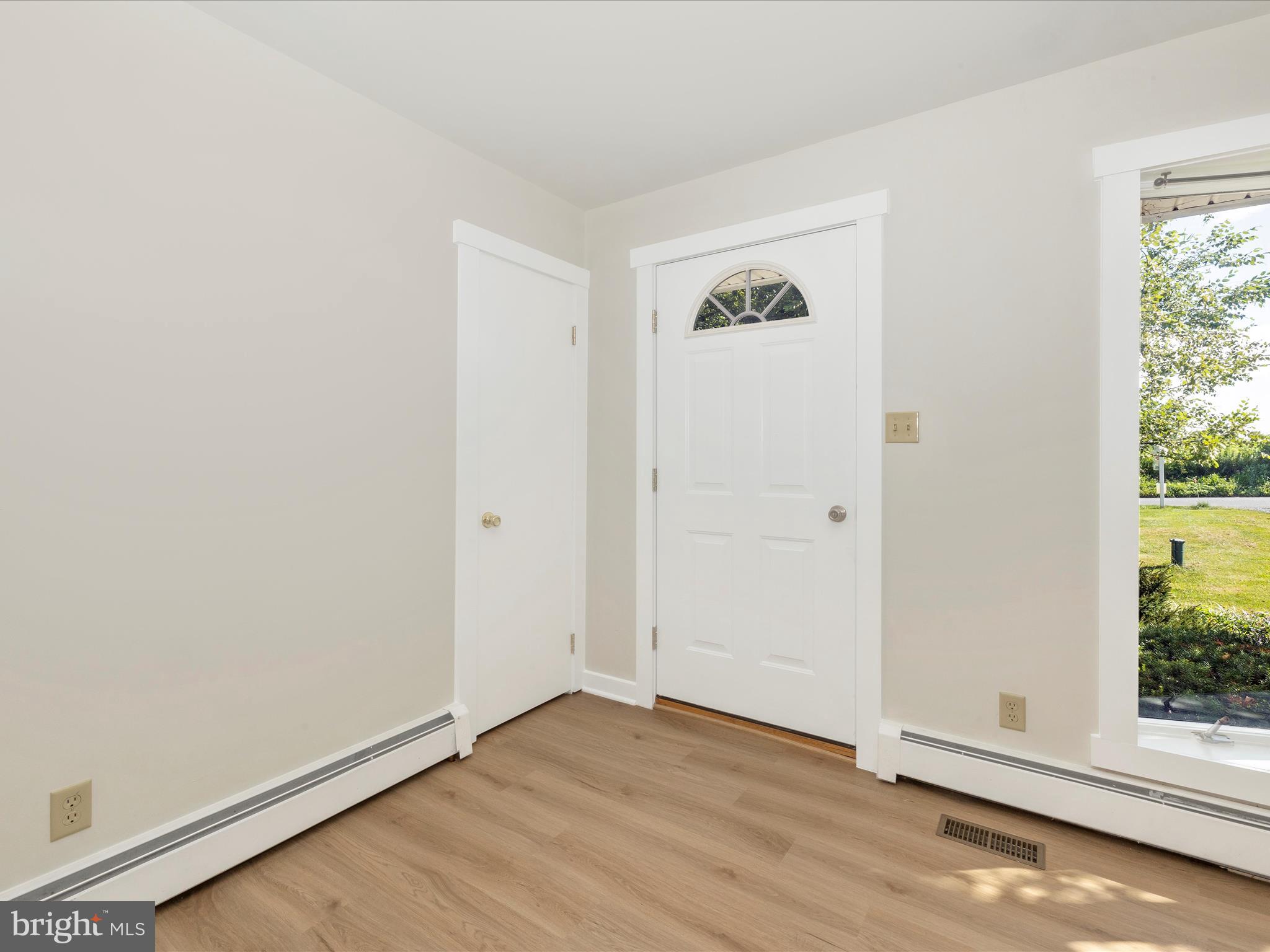 12436 Legore Road Keymar, MD 21757 - Photo 55 of 72 an empty room with wooden floor and windows