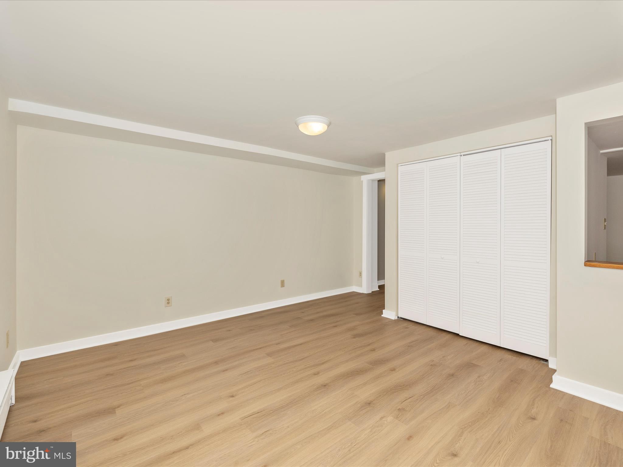 12436 Legore Road Keymar, MD 21757 - Photo 60 of 72 a view of an empty room with wooden floor