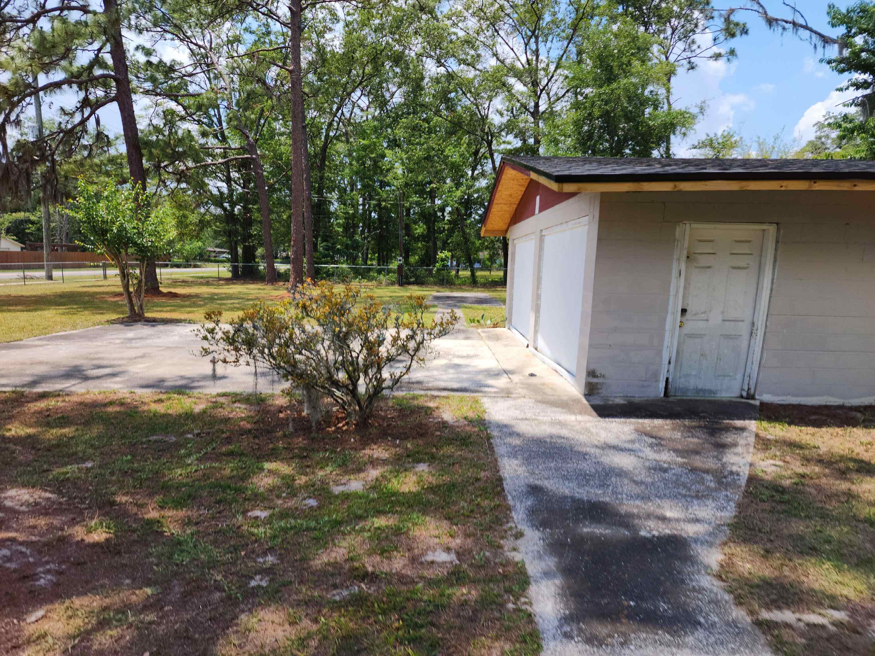 8431 Walden Road Jacksonville, FL 32244 - Photo 12 of 29 a view of backyard with large trees