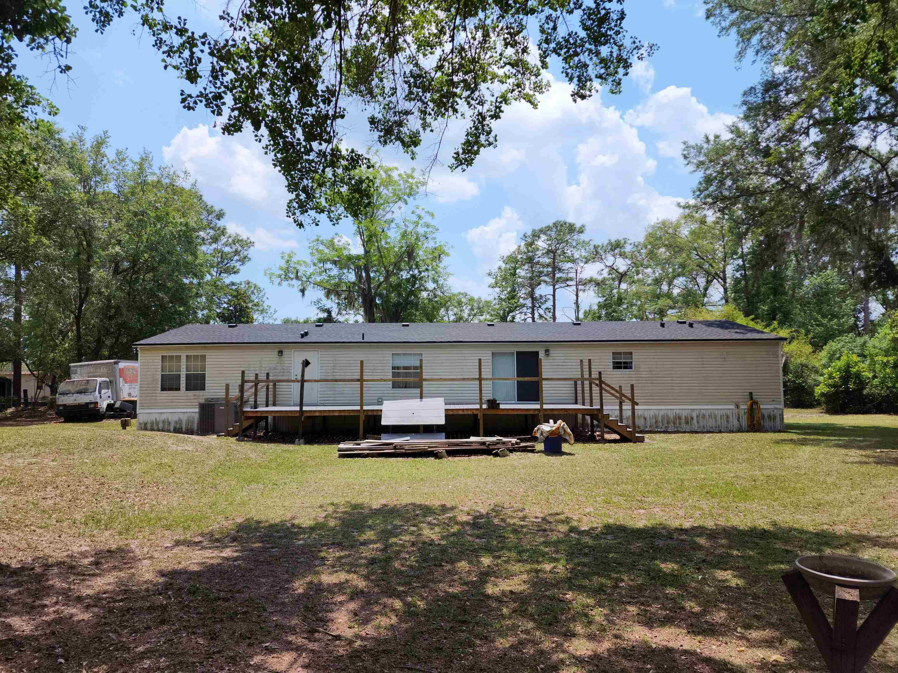 8431 Walden Road Jacksonville, FL 32244 - Photo 15 of 29 a view of a house with a big yard and large trees