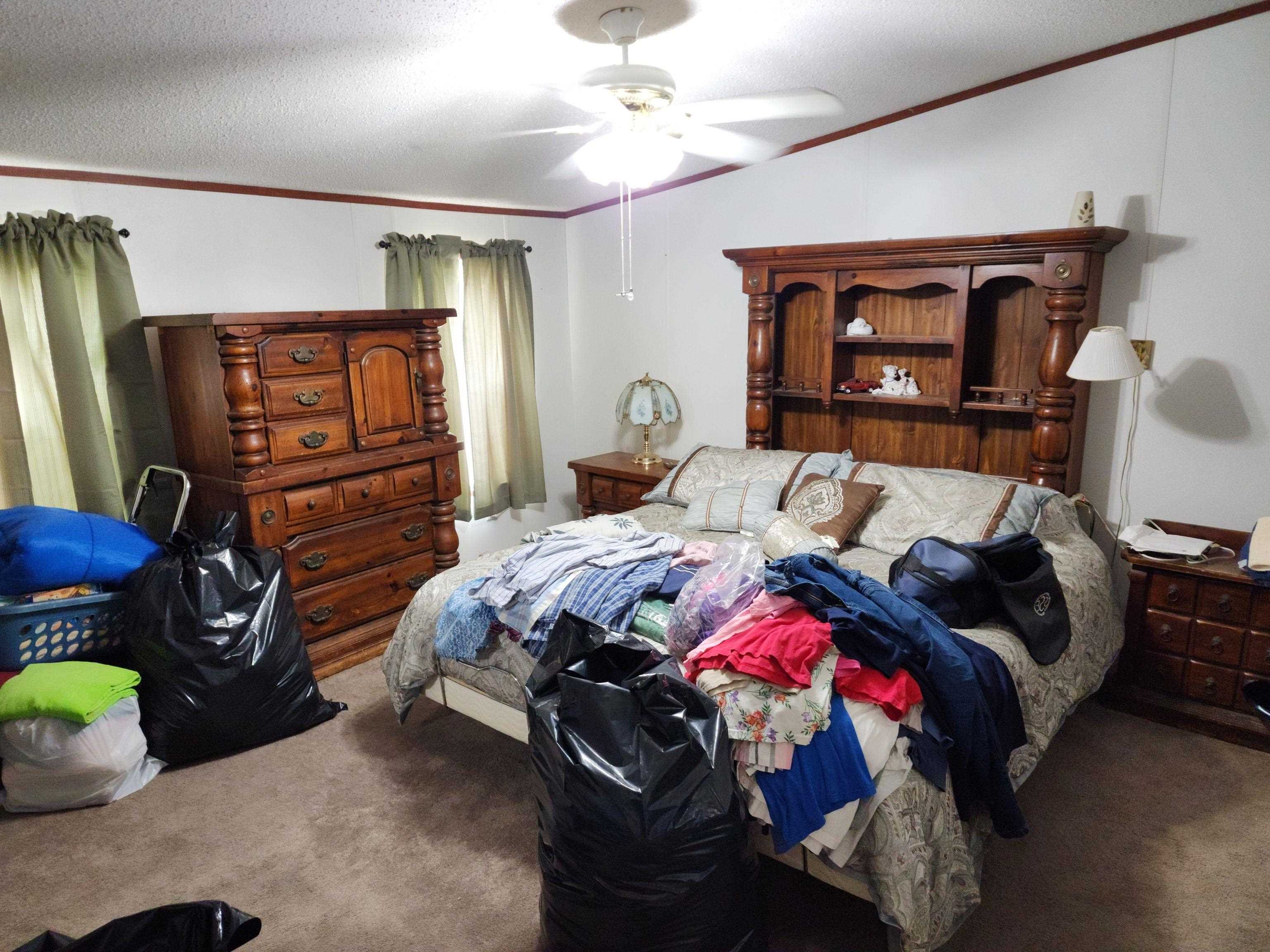 8431 Walden Road Jacksonville, FL 32244 - Photo 19 of 29 a bedroom with a bed and a mirror