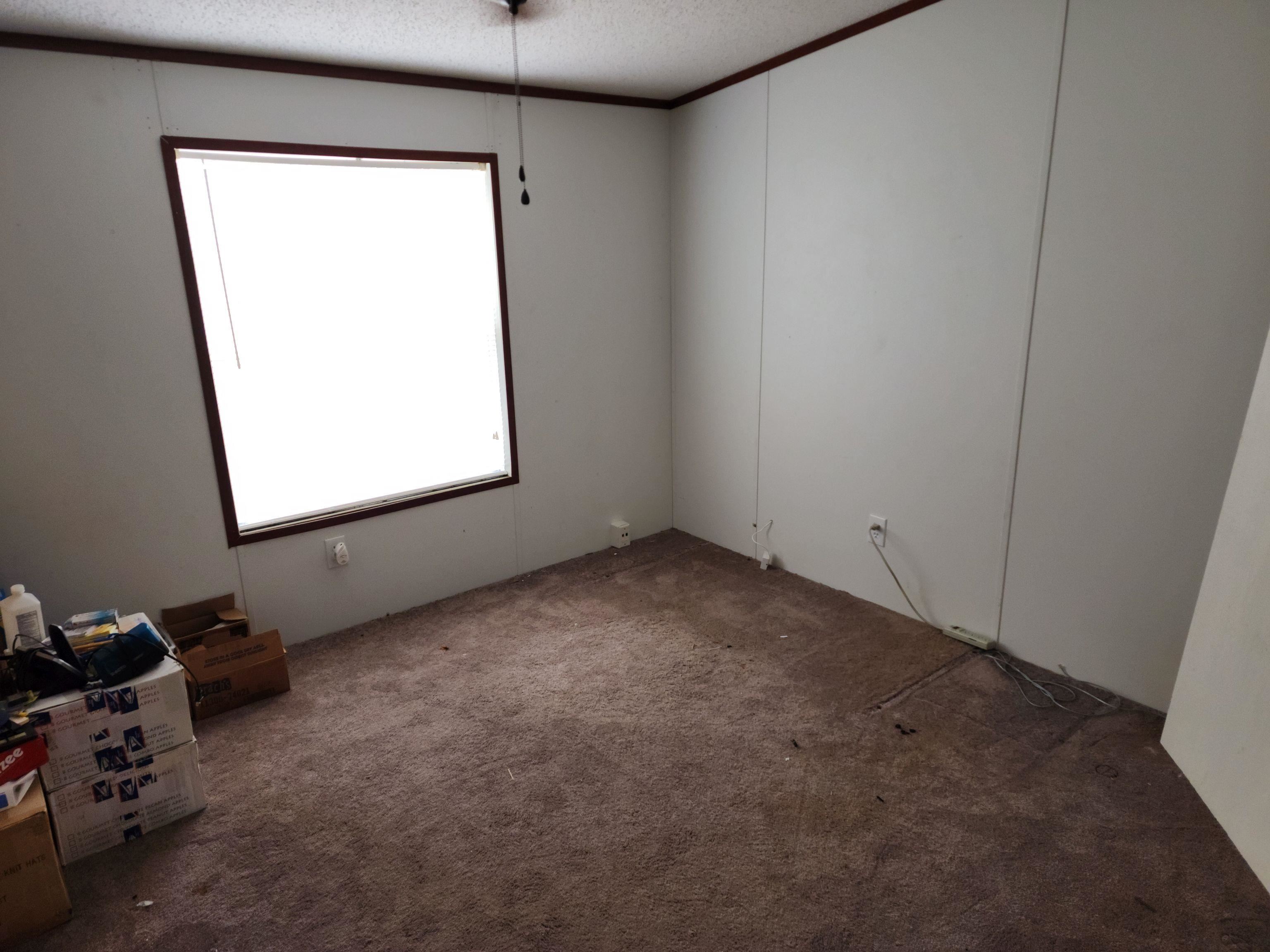 8431 Walden Road Jacksonville, FL 32244 - Photo 22 of 29 an empty room with a window