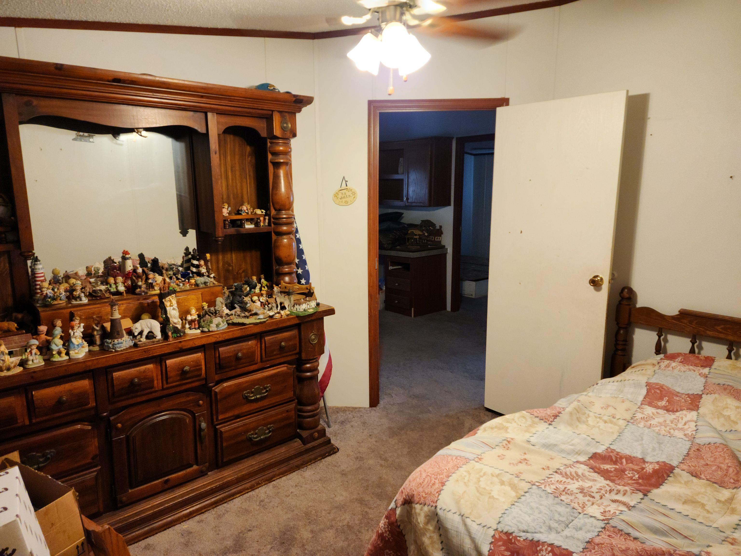 8431 Walden Road Jacksonville, FL 32244 - Photo 24 of 29 a bedroom with a bed and a dresser