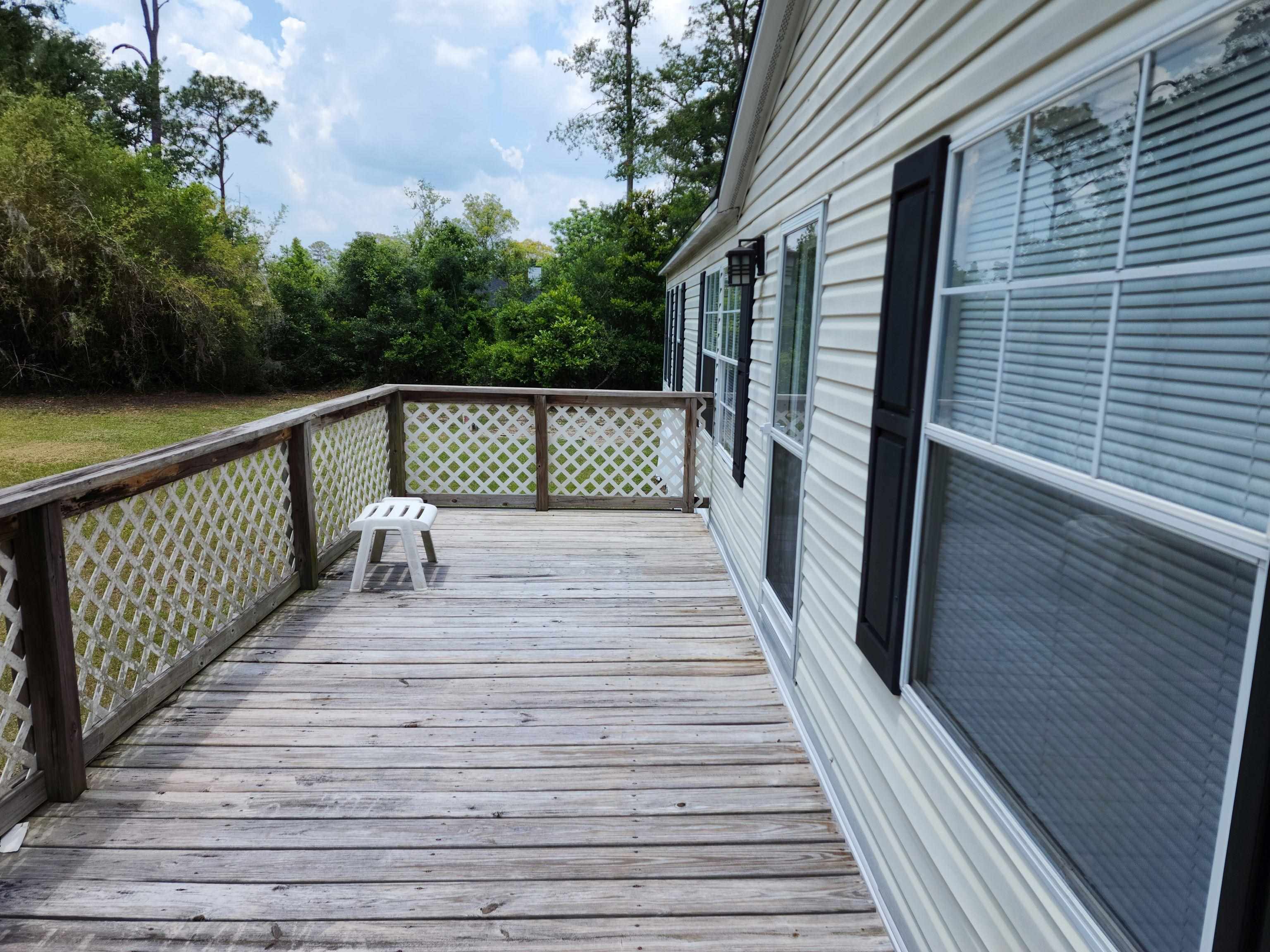 8431 Walden Road Jacksonville, FL 32244 - Photo 8 of 29 a balcony with wooden floor