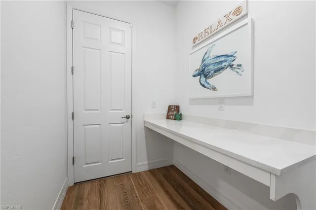 a view of cabinets with wooden floor