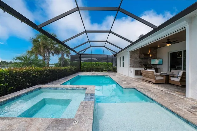 a view of a backyard with swimming pool