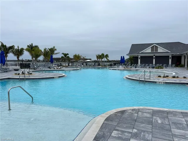 a view of a lake with furniture