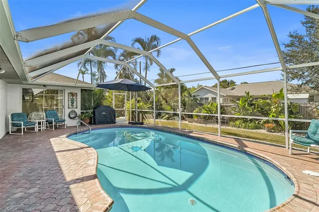 a view of a swimming pool with a patio