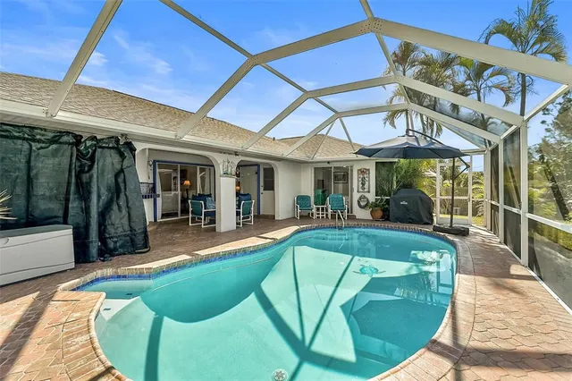 a view of a swimming pool with a patio