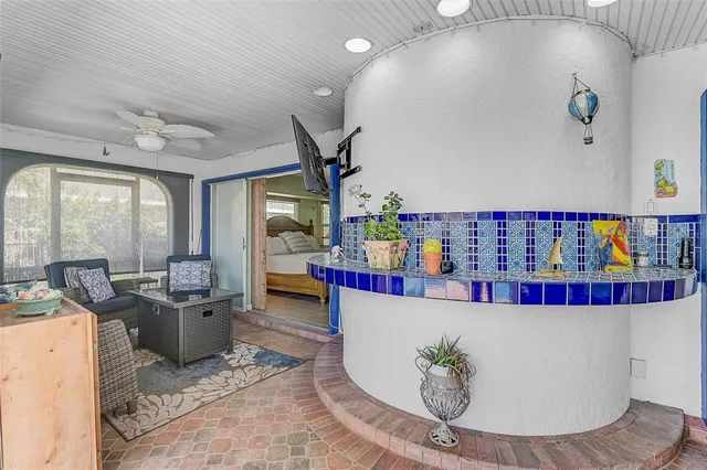 a view of a backyard with plants and swimming pool