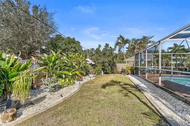 a view of a swimming pool with a lounge chairs