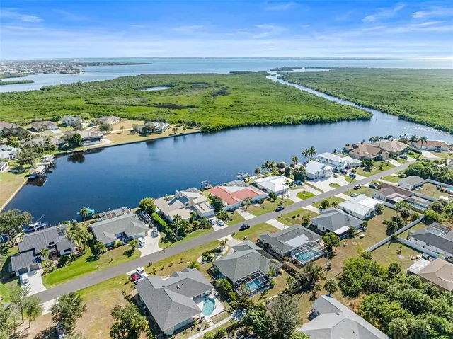 an aerial view of a houses with a lake view
