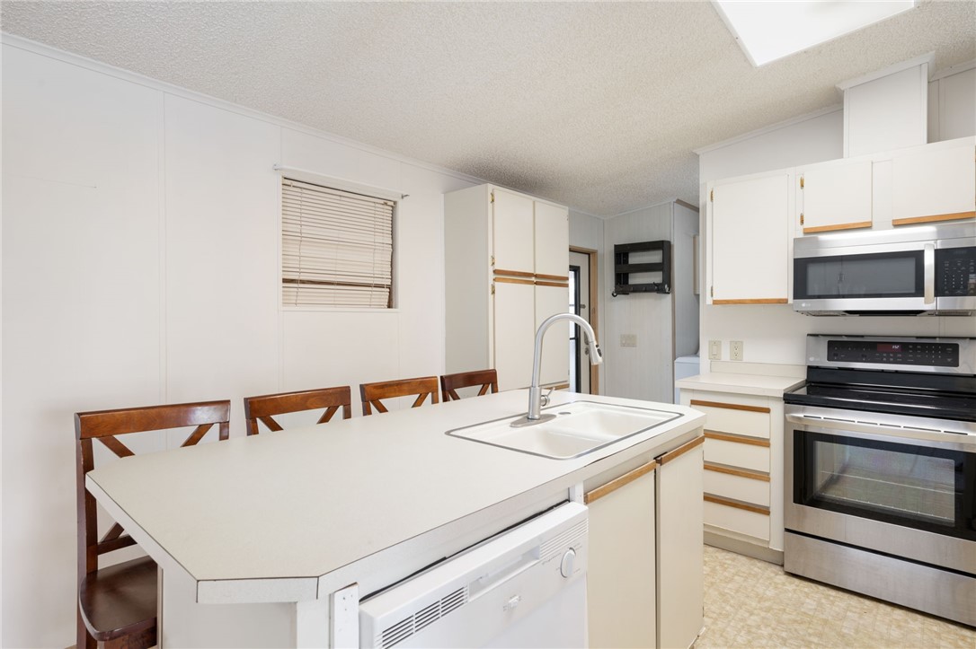 3836 13th Street Micco, FL 32976 - Photo 11 of 35 a utility room with dryer and washer