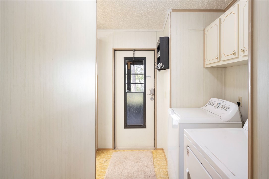 3836 13th Street Micco, FL 32976 - Photo 13 of 35 a utility room with dryer and washer