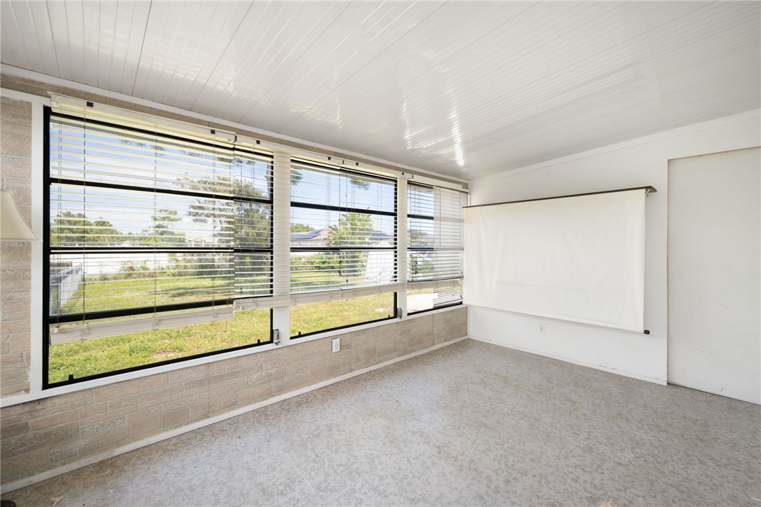 3836 13th Street Micco, FL 32976 - Photo 15 of 35 a view of a room with an empty space and the floor to ceiling window