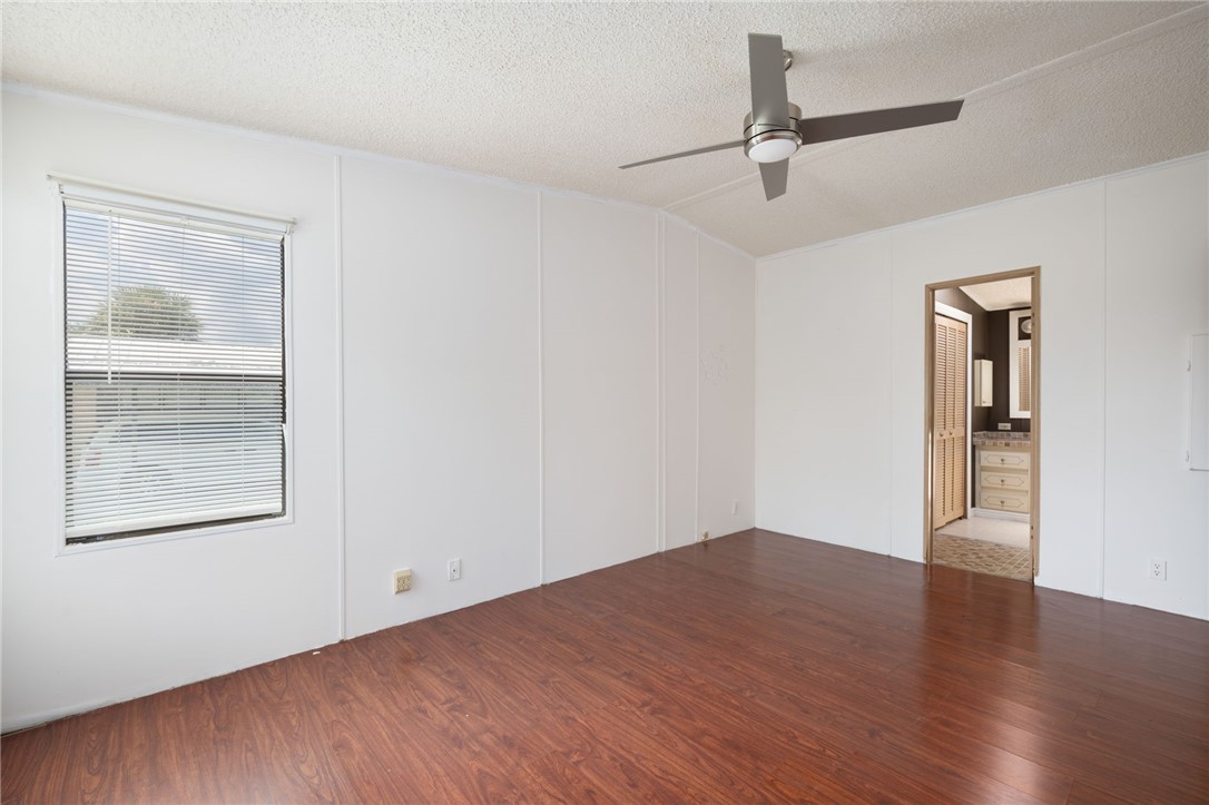 3836 13th Street Micco, FL 32976 - Photo 20 of 35 an empty room with wooden floor closet and windows