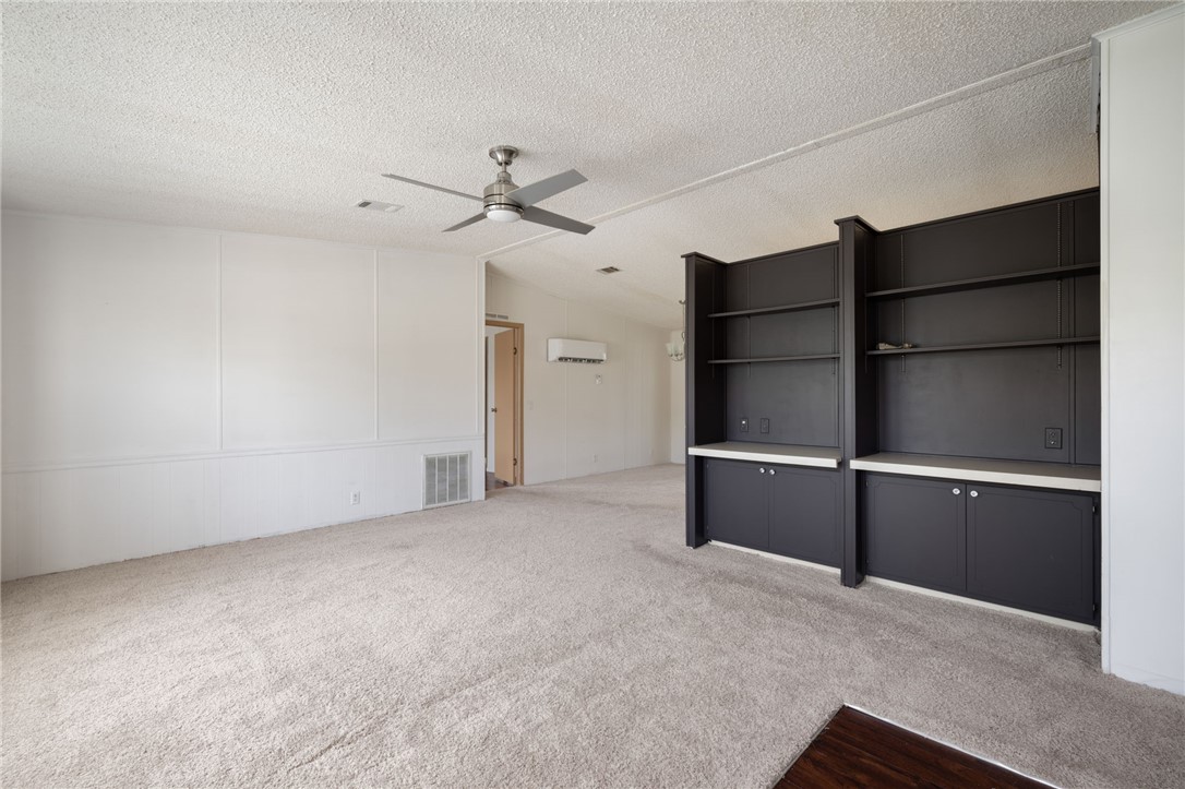3836 13th Street Micco, FL 32976 - Photo 2 of 35 a view of an empty room with a ceiling fan