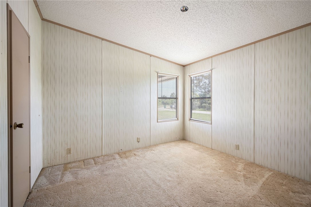 3836 13th Street Micco, FL 32976 - Photo 23 of 35 a view of an empty room with a window