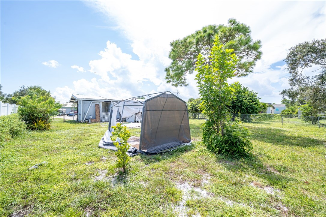 3836 13th Street Micco, FL 32976 - Photo 27 of 35 a backyard of a house with lots of green space