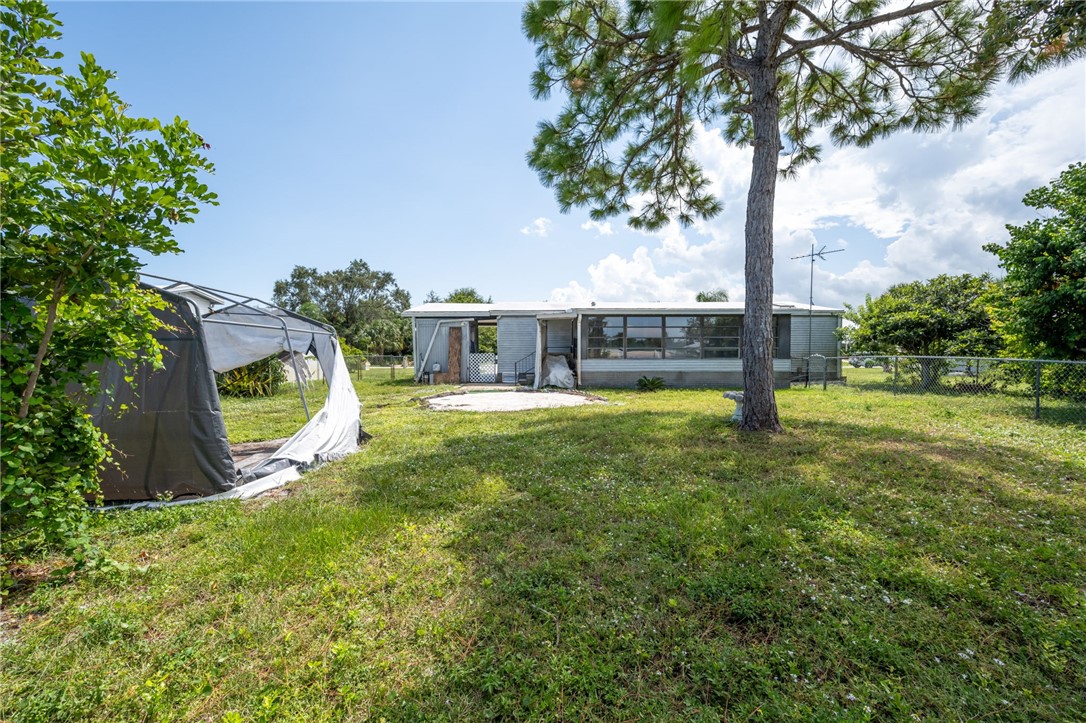 3836 13th Street Micco, FL 32976 - Photo 28 of 35 a view of a house with a park