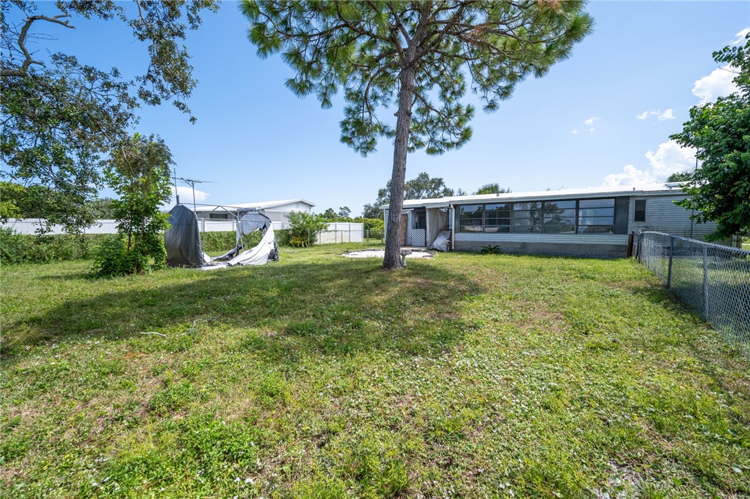 3836 13th Street Micco, FL 32976 - Photo 29 of 35 a view of a house with a yard porch and sitting area