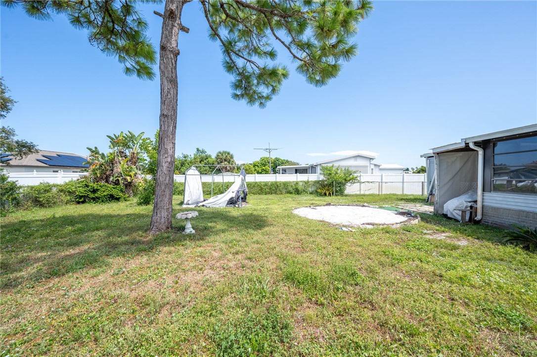3836 13th Street Micco, FL 32976 - Photo 30 of 35 a view of a backyard with a garden and plants