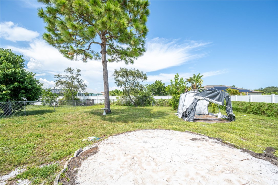 3836 13th Street Micco, FL 32976 - Photo 33 of 35 a view of a playground with a house