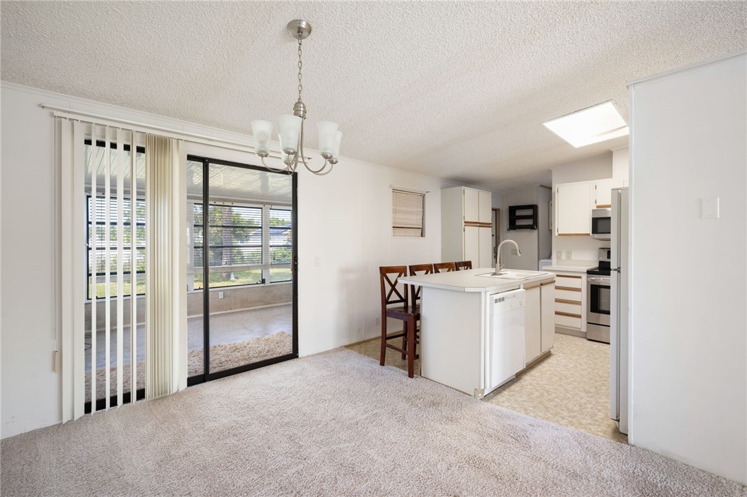 3836 13th Street Micco, FL 32976 - Photo 8 of 35 a view of a kitchen with refrigerator and cabinets