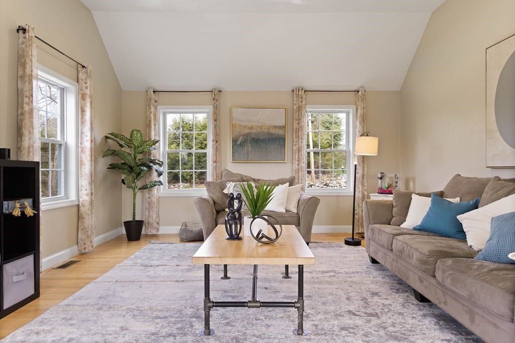360 Richardson Road Dracut, MA 01826 - Photo 11 of 25 a living room with furniture potted plant and a large window