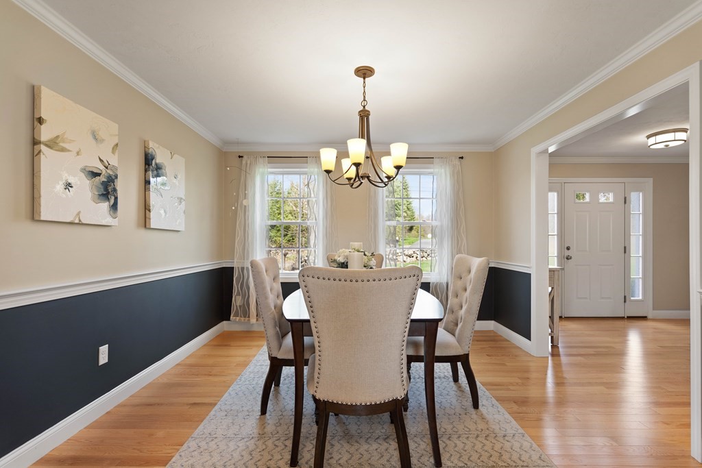 360 Richardson Road Dracut, MA 01826 - Photo 4 of 25 a view of a dining room with furniture window and wooden floor