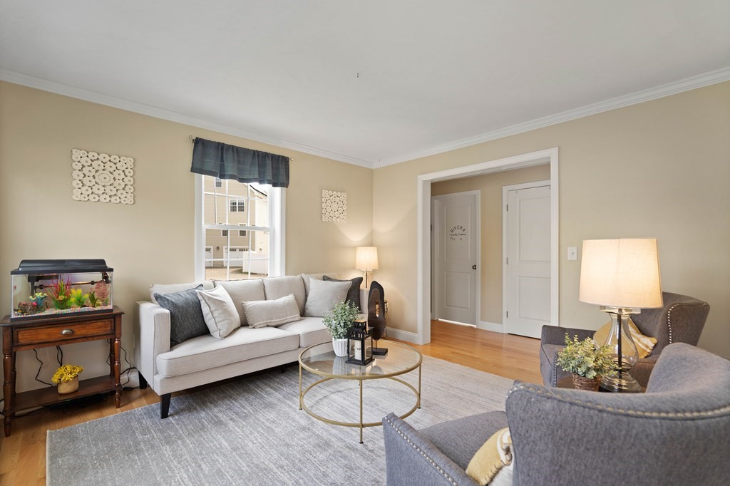 360 Richardson Road Dracut, MA 01826 - Photo 5 of 25 a living room with furniture and a lamp