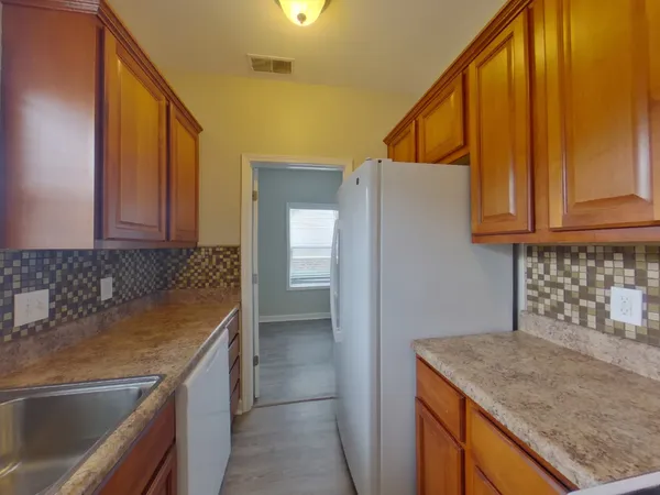 a kitchen with a sink and cabinets