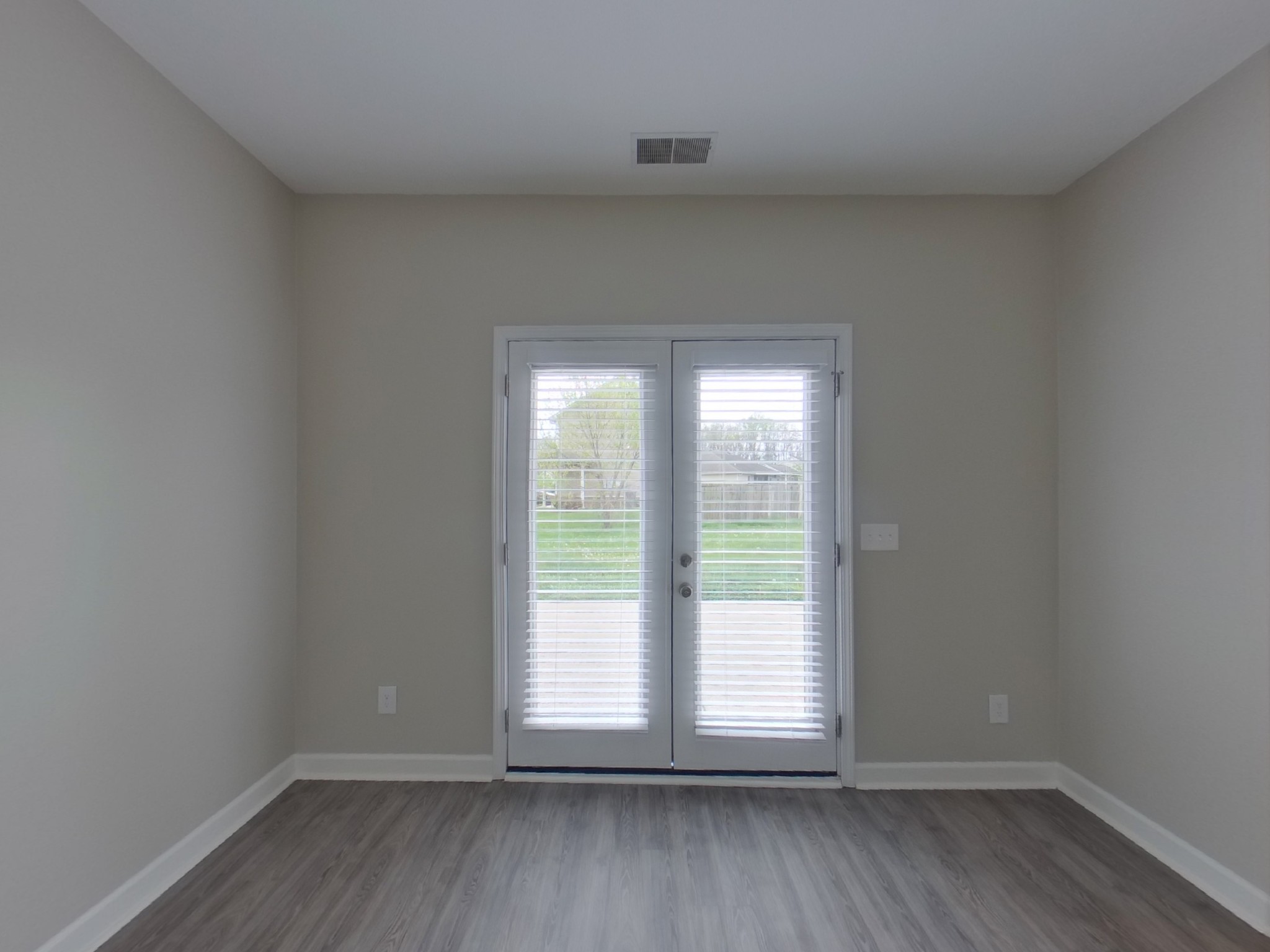 5013 Morning Dove Lane Spring Hill, TN 37174 - Photo 5 of 15 an empty room with wooden floor and windows