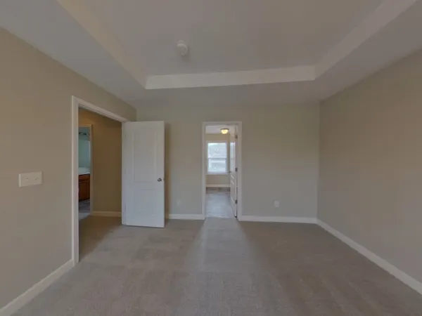 a view of an empty room and closet area