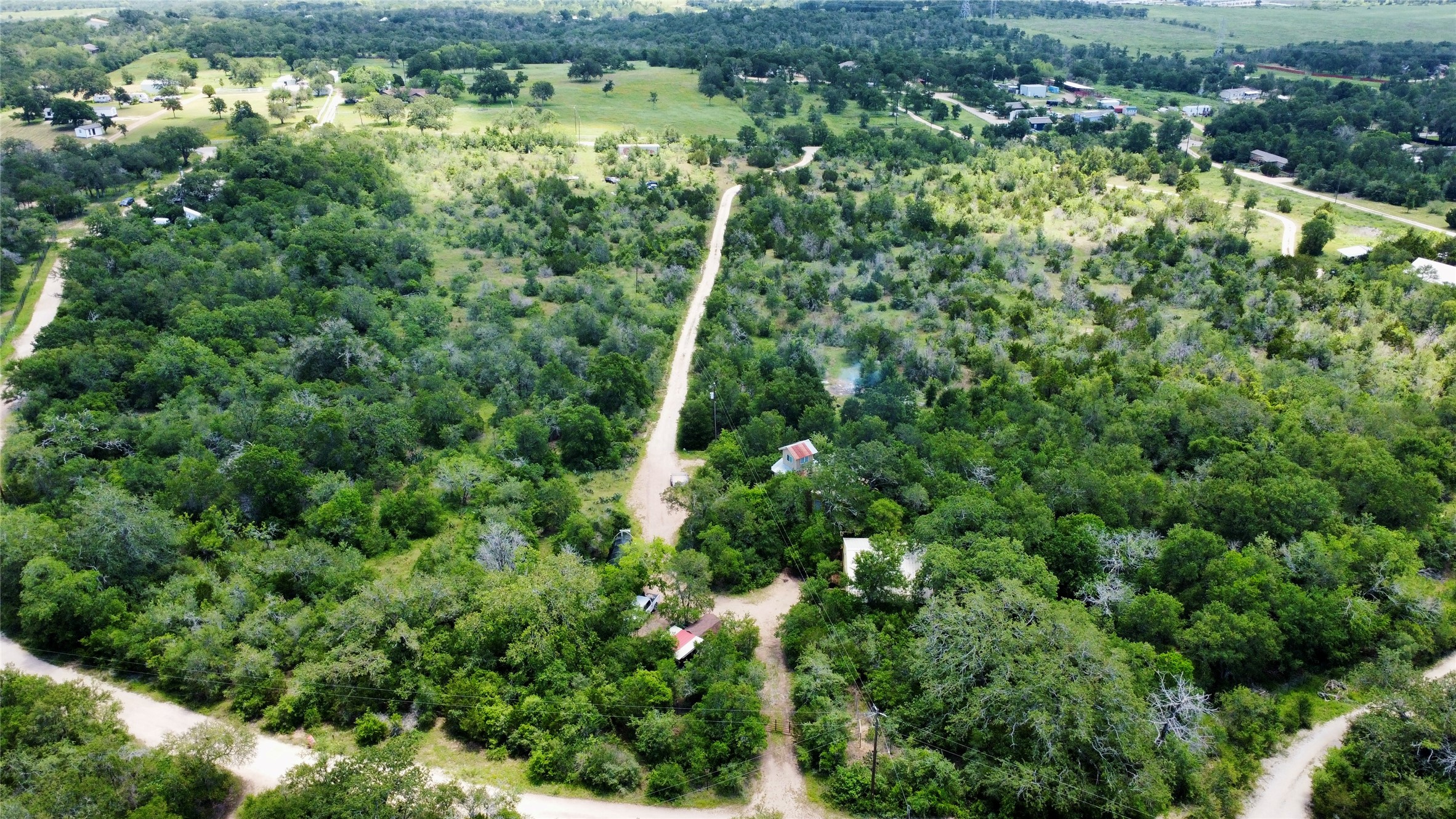 1998 Upper Elgin River Road Elgin, TX 78621 - Photo 23 of 28 an aerial view of residential houses with outdoor space and trees