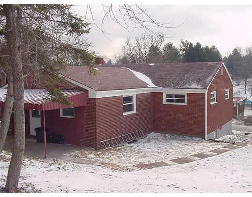 1010 Wren Drive McKees Rocks, PA 15136 - Photo 2 of 15 Exterior Back. Entire home is brick , Covered patio, large backyard.