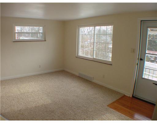 1010 Wren Drive McKees Rocks, PA 15136 - Photo 3 of 15 Living Room. Hardwood entry, new windows & front door & stormdoor. Entire home has new carpeting.