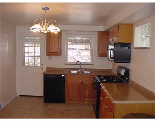 1010 Wren Drive McKees Rocks, PA 15136 - Photo 4 of 15 Kitchen. New cabinets, sink, & dishwasher, gas stove & micro wave.