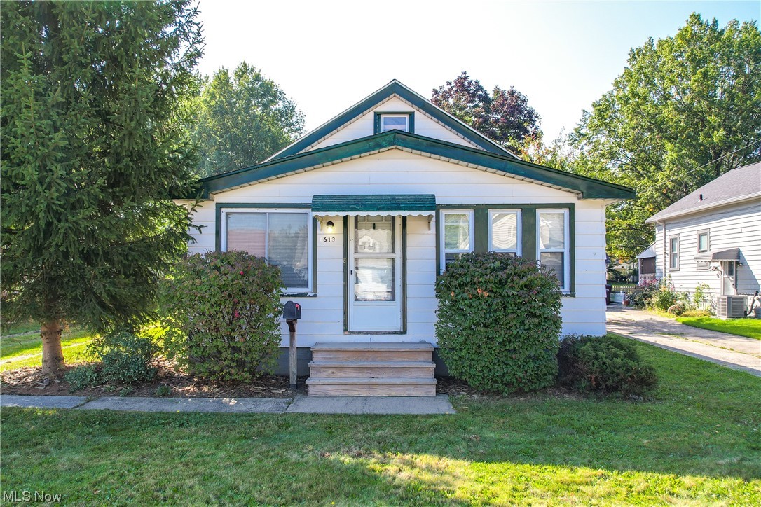 4613 Snow Road Cleveland, OH 44134 - Photo 1 of 33 Bungalow-style home featuring central AC unit and a front yard