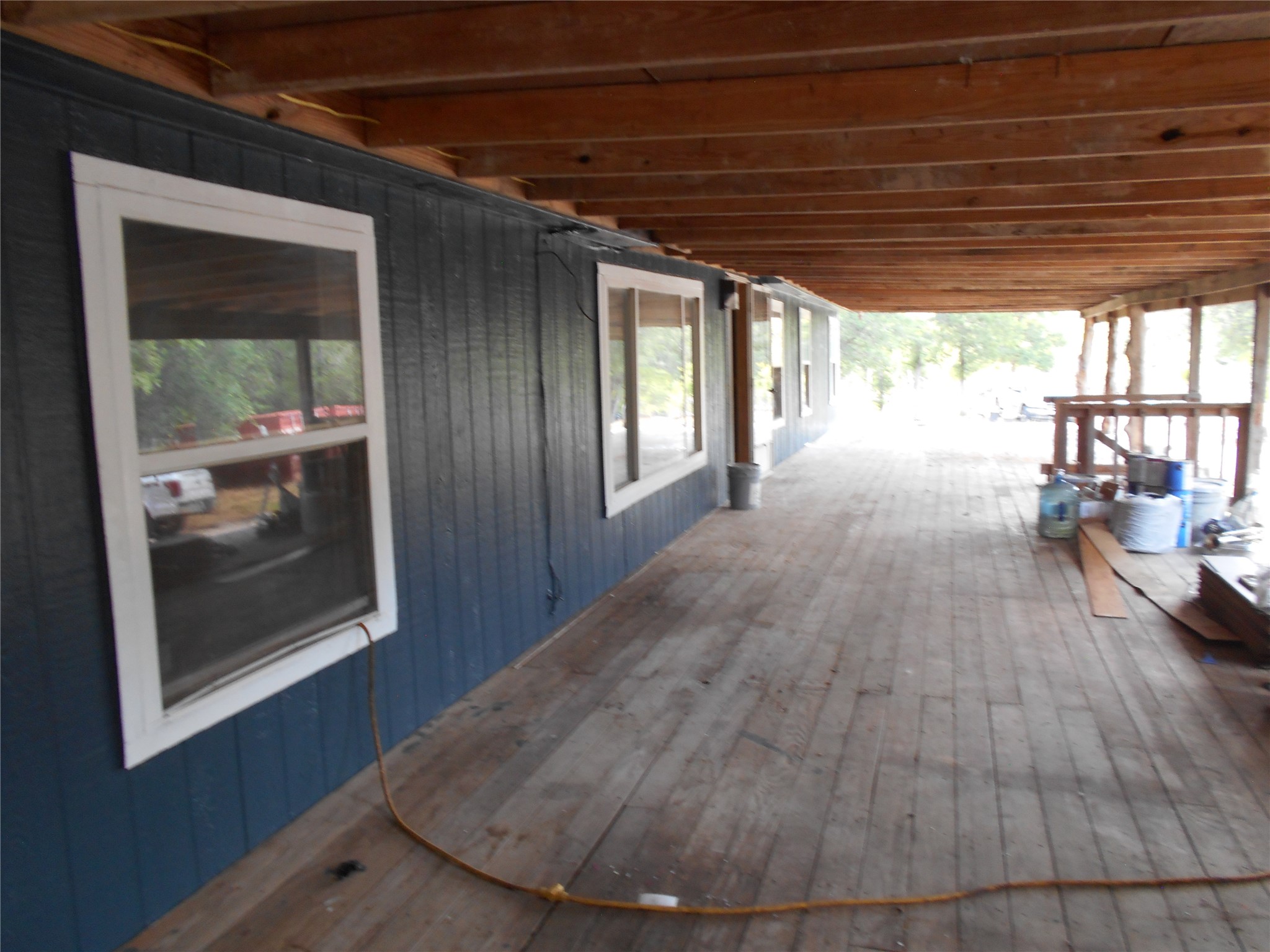 8001 Burleson Manor Road Manor, TX 78653 - Photo 7 of 31 A spacious covered porch offers a sheltered outdoor living area with a view of the surrounding landscape.