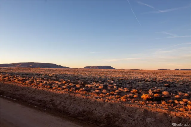 an aerial view of residential house and green space
