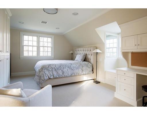 131 Laurel Road Brookline, MA 02467 - Photo 15 of 22 a bedroom with a bed and a dresser