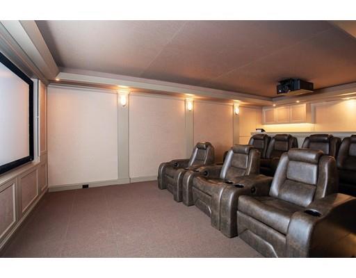 131 Laurel Road Brookline, MA 02467 - Photo 17 of 22 a media room with lots of chairs and a projector