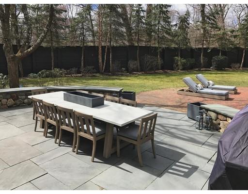 131 Laurel Road Brookline, MA 02467 - Photo 19 of 22 a view of a chairs and table in the patio