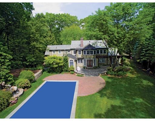 131 Laurel Road Brookline, MA 02467 - Photo 22 of 22 a view of a house with a yard and potted plants
