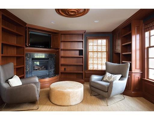 131 Laurel Road Brookline, MA 02467 - Photo 5 of 22 a living room with furniture wooden floor and a fireplace