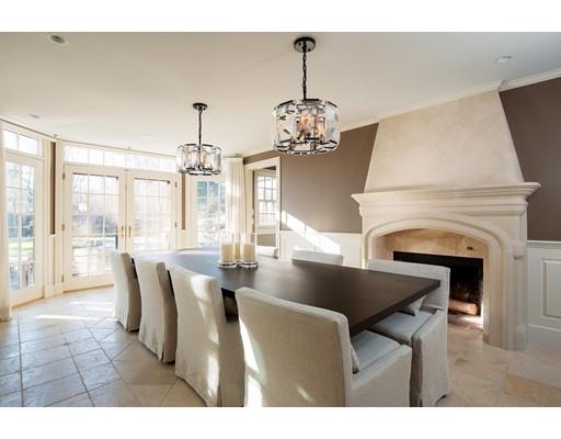 131 Laurel Road Brookline, MA 02467 - Photo 7 of 22 a dining room with furniture a chandelier and wooden floor