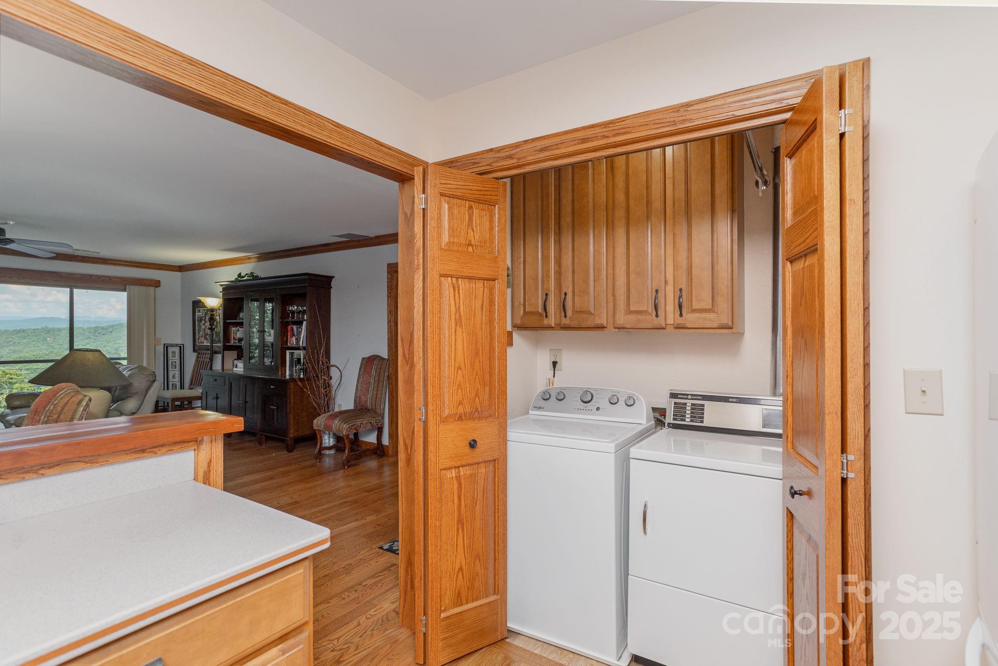 524 Three Mile Knob Road, Unit 3 Pisgah Forest, NC 28768 - Photo 23 of 33 a view of a kitchen with storage and utility